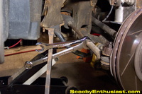 Flare or line nut wrench being used to loosen tie rod jam nut